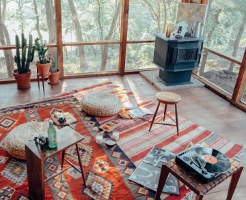 aztec rug woodstove cactuses and windows
