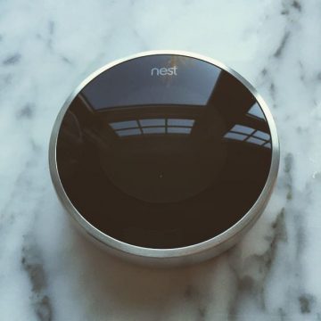 nest learning thermostat on marble