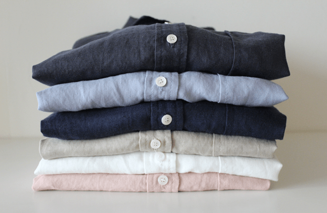 stack of simple pastel shirts