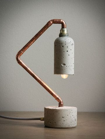 concrete and brass lamp